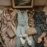 Vintage occasionwear dresses and accessories arranged for wedding guest dress codes and second hand event dressing