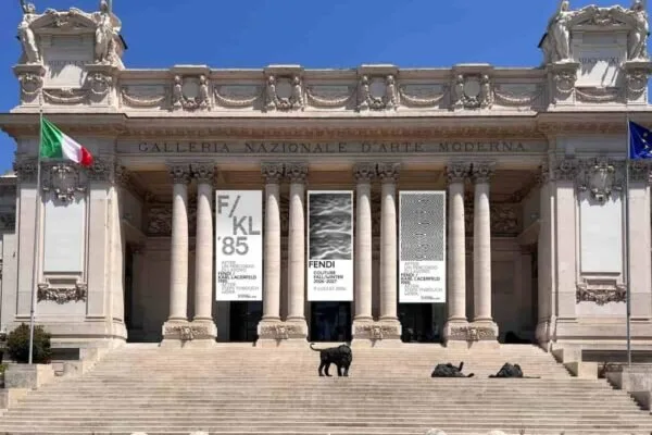 Roman architectural stone facade and elegant luxury window detail evoking Fendi heritage in Rome.